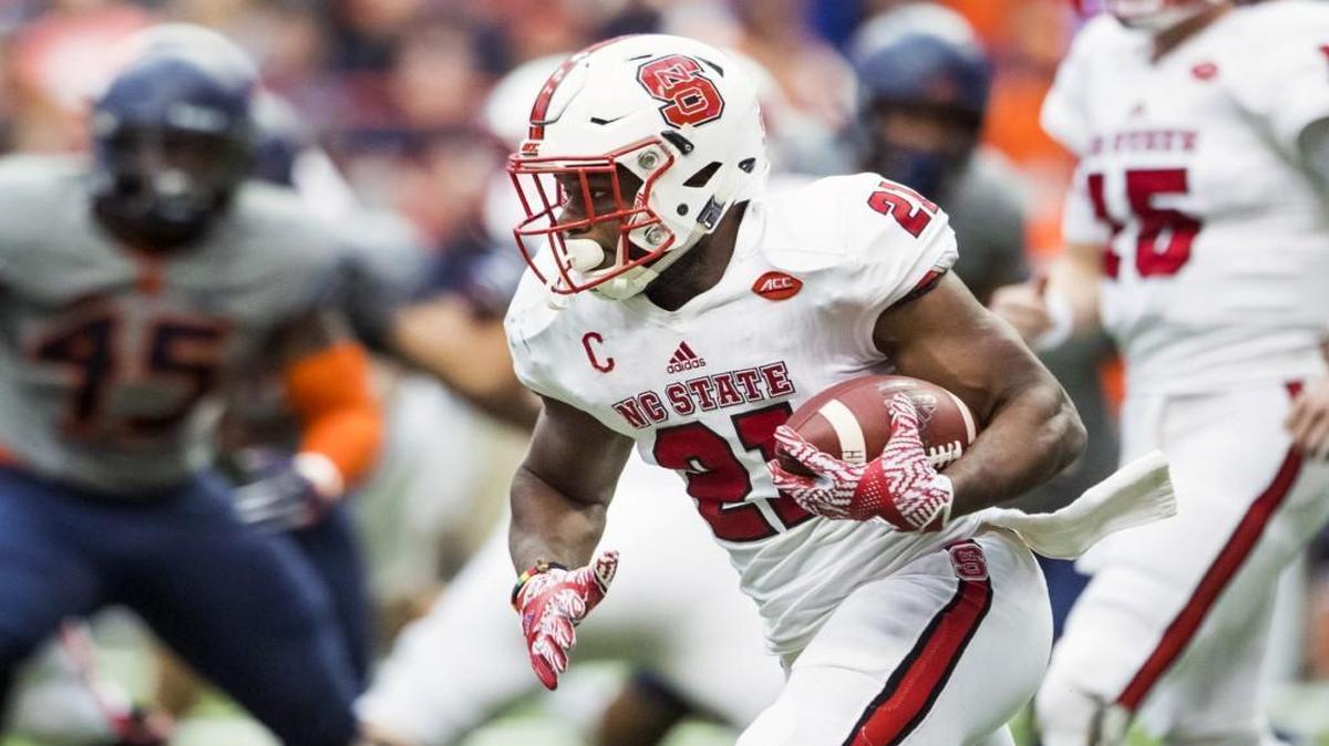 N.C. State’s Matt Dayes #21 of the North Carolina State Wolfpack carries the ball during the first half against Syracuse at The Carrier Dome.