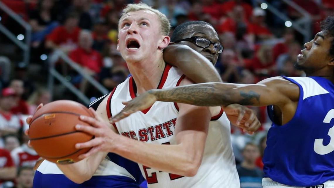 N.C. State’s Maverick Rowan, left, is fouled by Lynn’s Jamal Palmer, back, as Juwan Frazier, right, defends on Nov. 3. Rowan has missed the past six games with a concussion.
