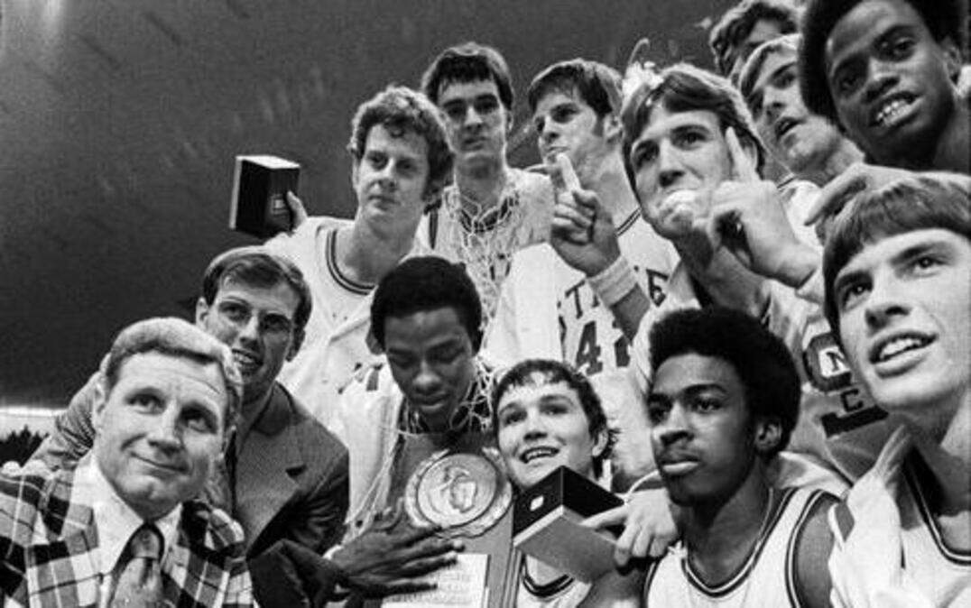 
The 1974 NC State Wolfpack poses with the National Championship trophy after defeating Marquette for the title.
