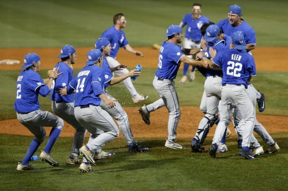 The Kentucky Wildcats celebrate after defeating the N.C. State Wolfpack 10-5 in the NCAA Regional at Cliff Hagan Stadium in Lexington, Ky.