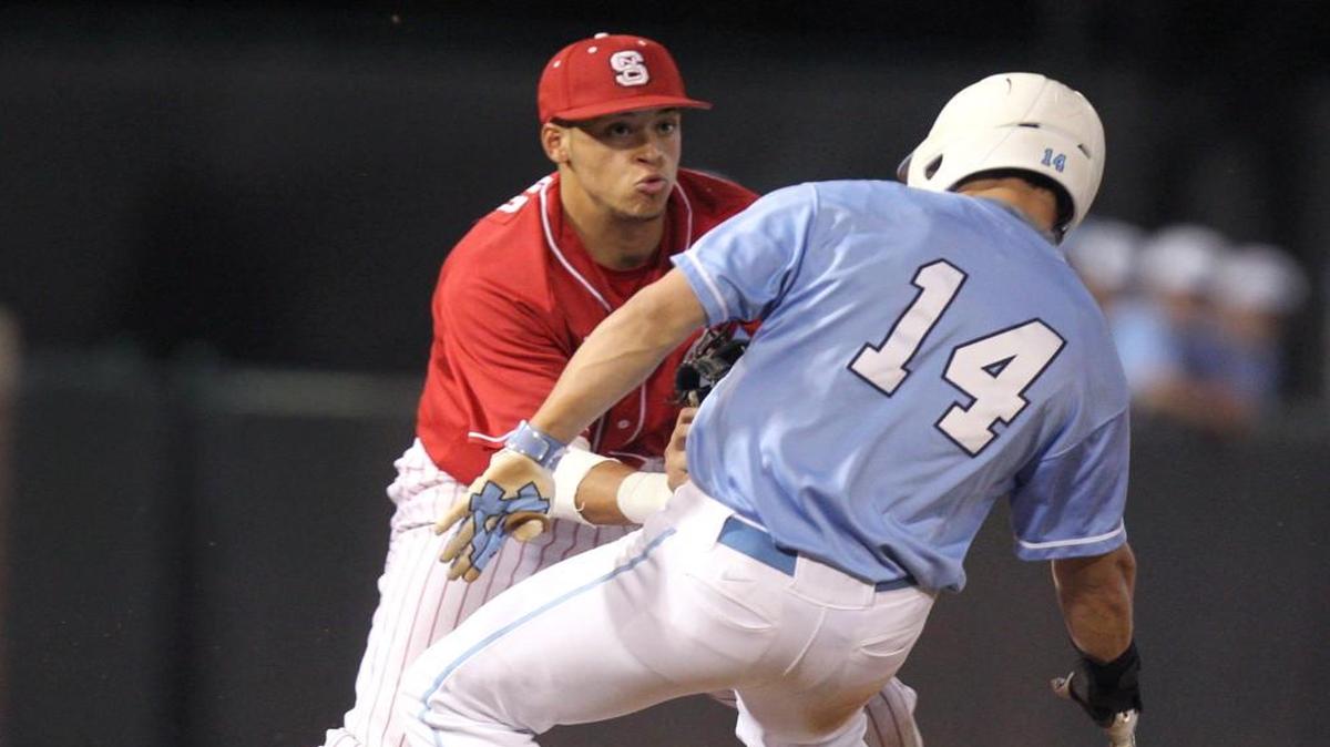 N.C. State’s Joe Dunand (10) tags out North Carolina's UNC's Tyler Ramirez (14) during UNC's 2-1 victory Friday, April 10, 2015 at Boshamer Stadium in Chapel Hill.