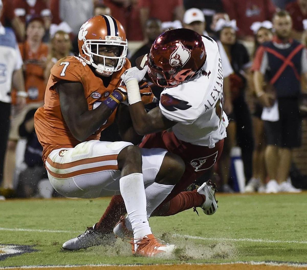 Louisville cornerback Jaire Alexander (10) and Clemson wide receiver Mike Williams (7) fight for the ball in the end zone during game on Saturday, Oct. 1, 2016, in Clemson, S.C. The play was ruled an interception for Louisville. (AP Photo/Rainier Ehrhardt)