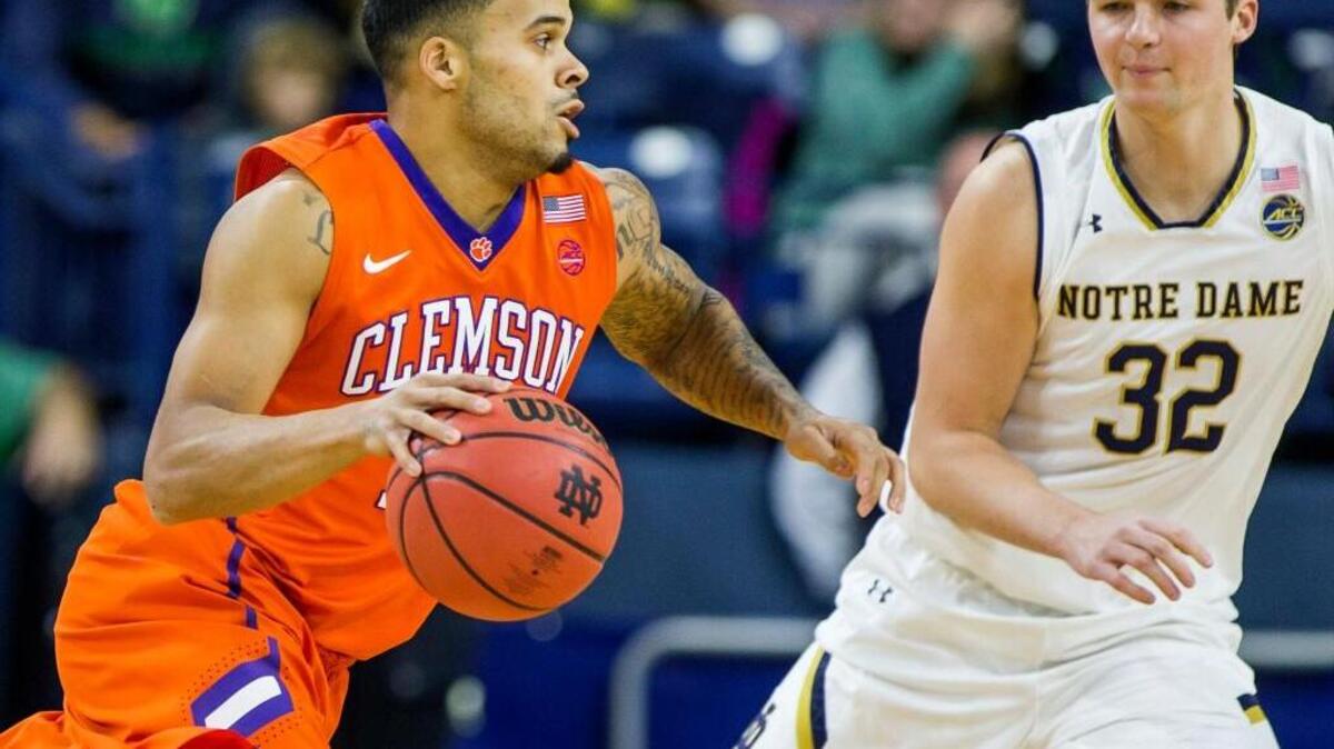 Clemson’s Avry Holmes, left, moves by Notre Dame’s Steve Vasturia on Jan. 17. Holmes and the Tigers host N.C. State on Wednesday night.