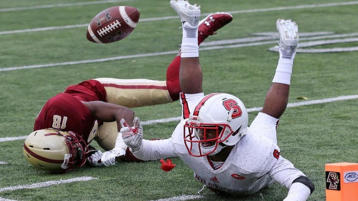 N.C. State cornerback Niles Clark, right, breaks up a pass to Boston College wide receiver Thadd Smith.