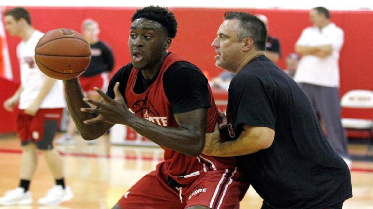 N.C. State assistant coach Heath Schroyer works with Abdul-Malik Abu during N.C. State basketball's first practice of the season at the Curtis & Jacqueline Dail Basketball Complex in Raleigh Friday, Sept. 30, 2016.