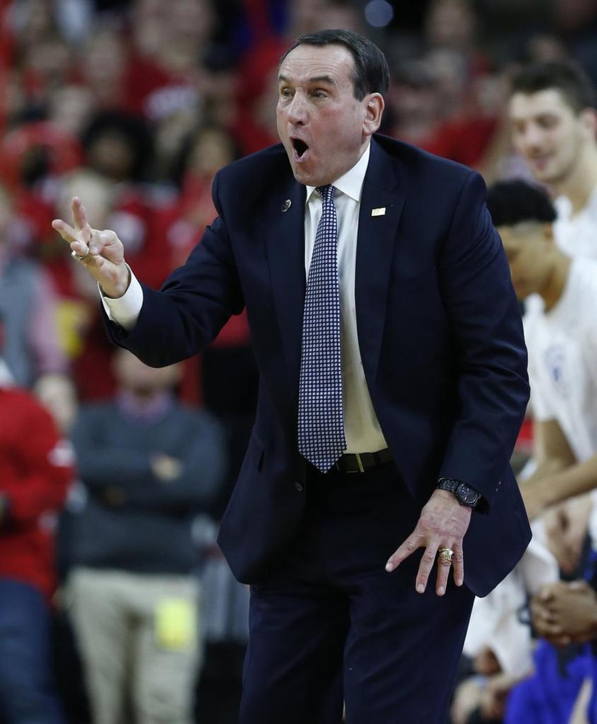 Duke head coach Mike Krzyzewski yells to his team during the first half of N.C. State's game against Duke at PNC Arena on Jan. 6, 2018.