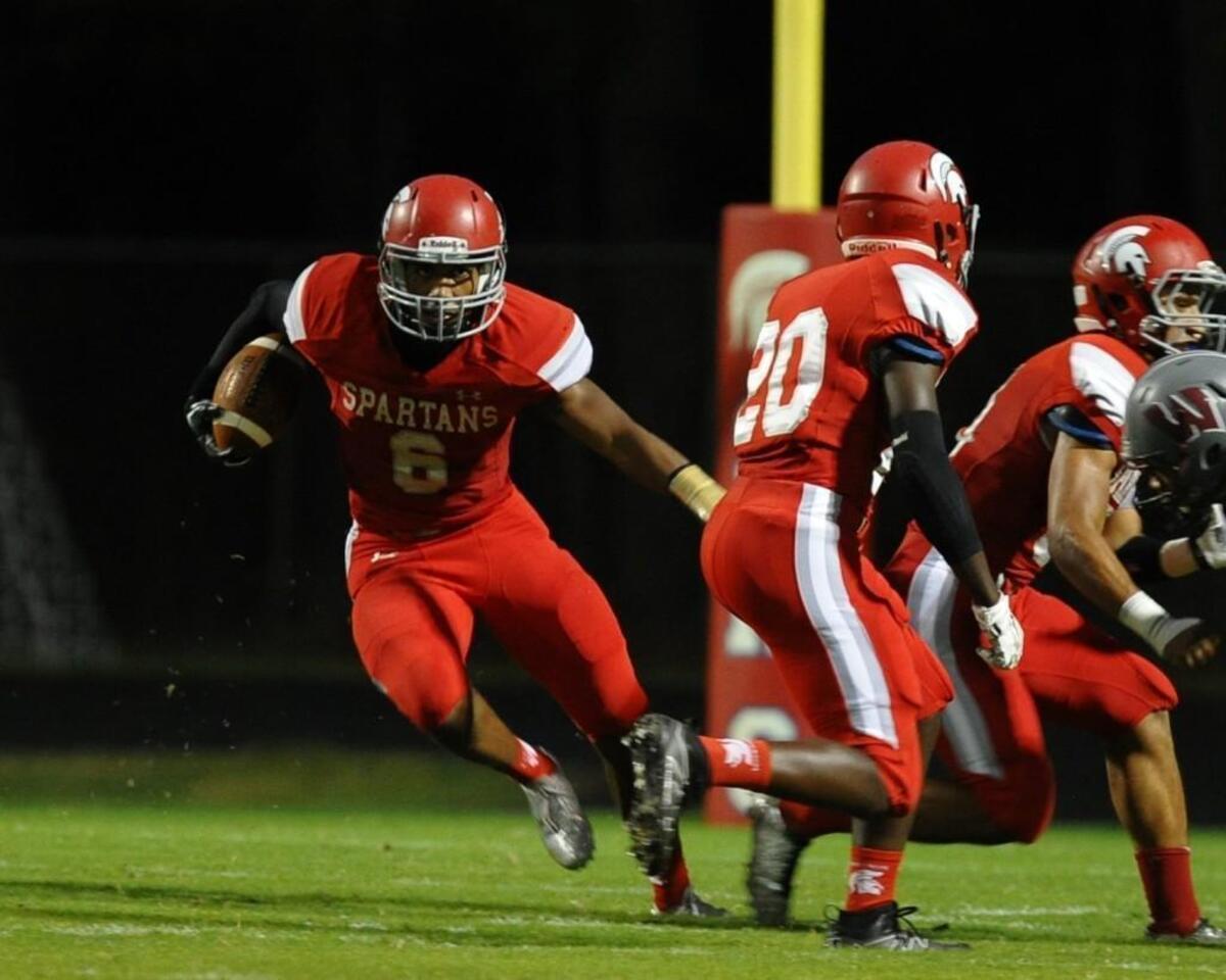Sanderson’s Trent Pennix (6), shown here running against Wakefield during a 2016 football game, signed with N.C. State to play with the Wolfpack starting in 2018.