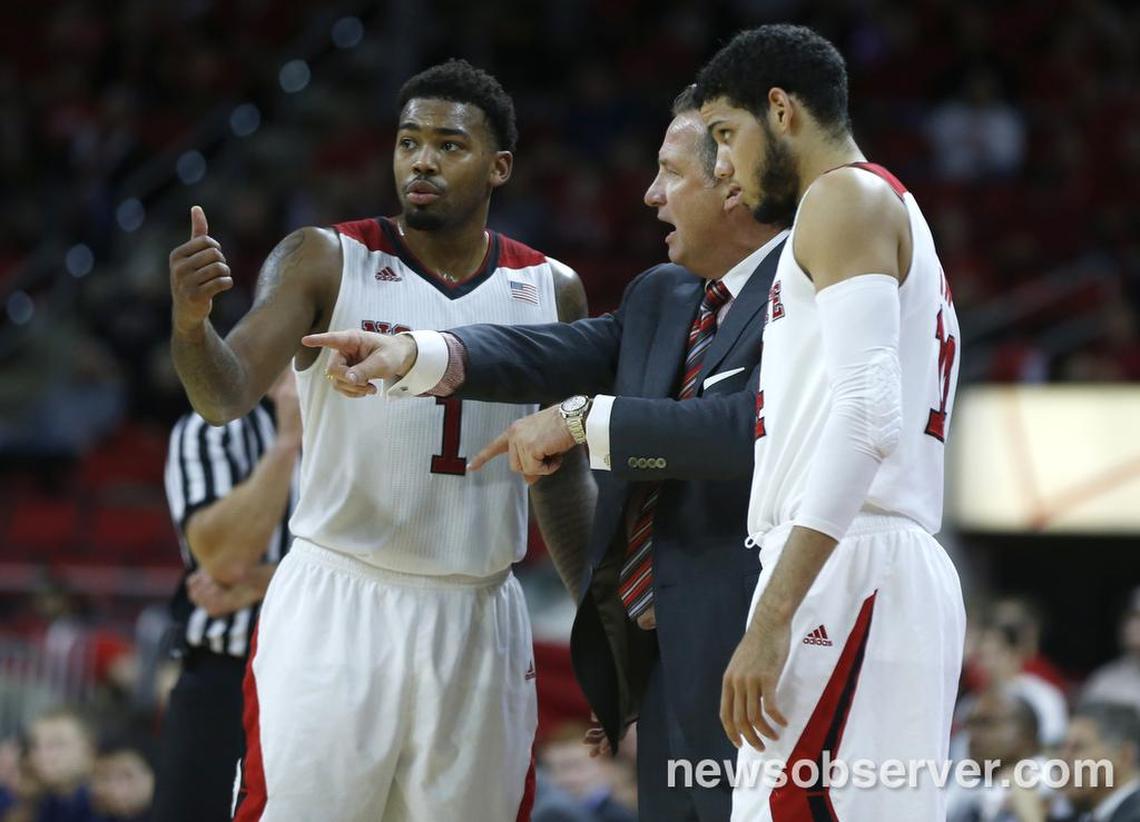 N.C. State's head coach Mark Gottfried talks with Trevor Lacey, left, and Caleb Martin during the Wolfpack's 84-72 victory over Richmond at PNC Arena November 26, 2014.