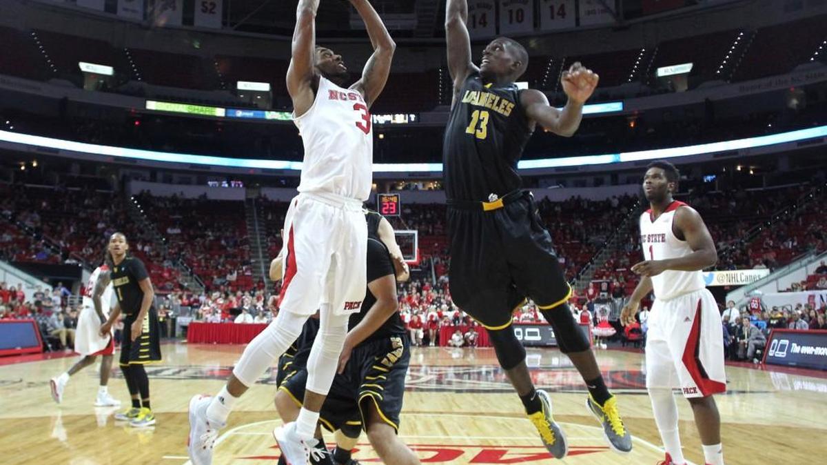 N.C. State's Terry Henderson (3) drives to the basket as Cal State Los Angeles’ Joel Brokenbrough (13) defends during the Wolfpack's 71-54 exhibition victory over Cal State Los Angeles at PNC Arena in Raleigh Sunday, Nov. 8, 2015.