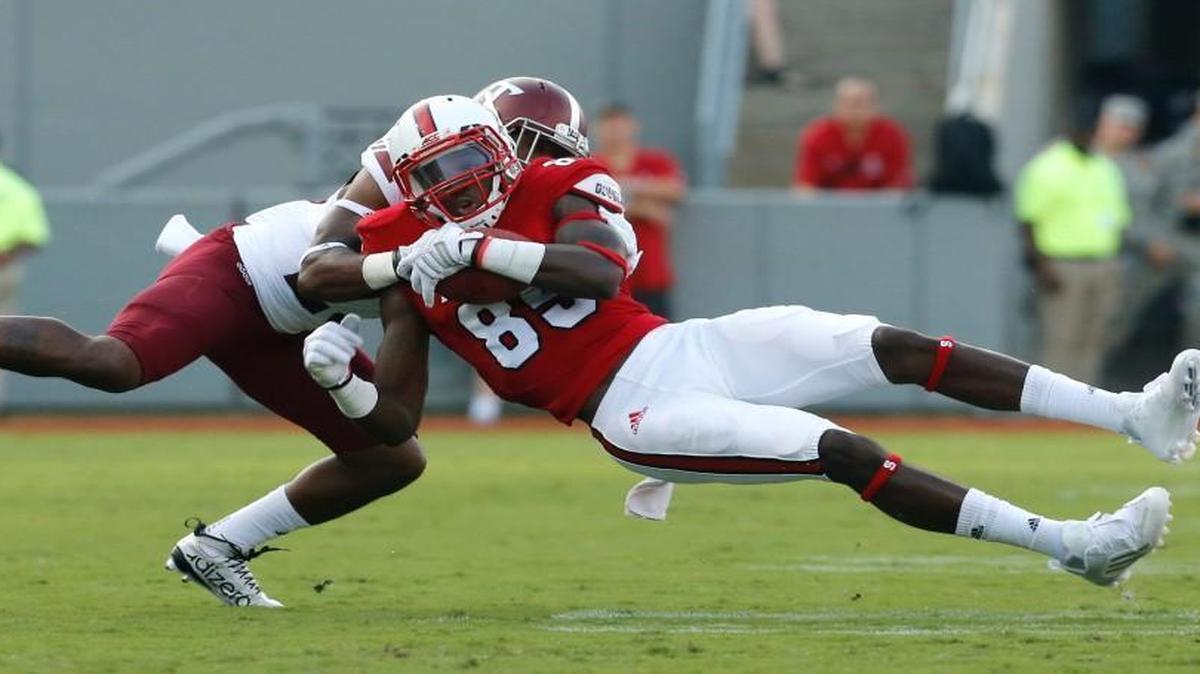 
N.C. State wide receiver  Ju’Micael Ramos (85) makes the reception while defended by Troy cornerback Josh Marshall (25) during the first half of the Wolfpack's game Saturday against Troy at Carter-Finley Stadium in Raleigh.
