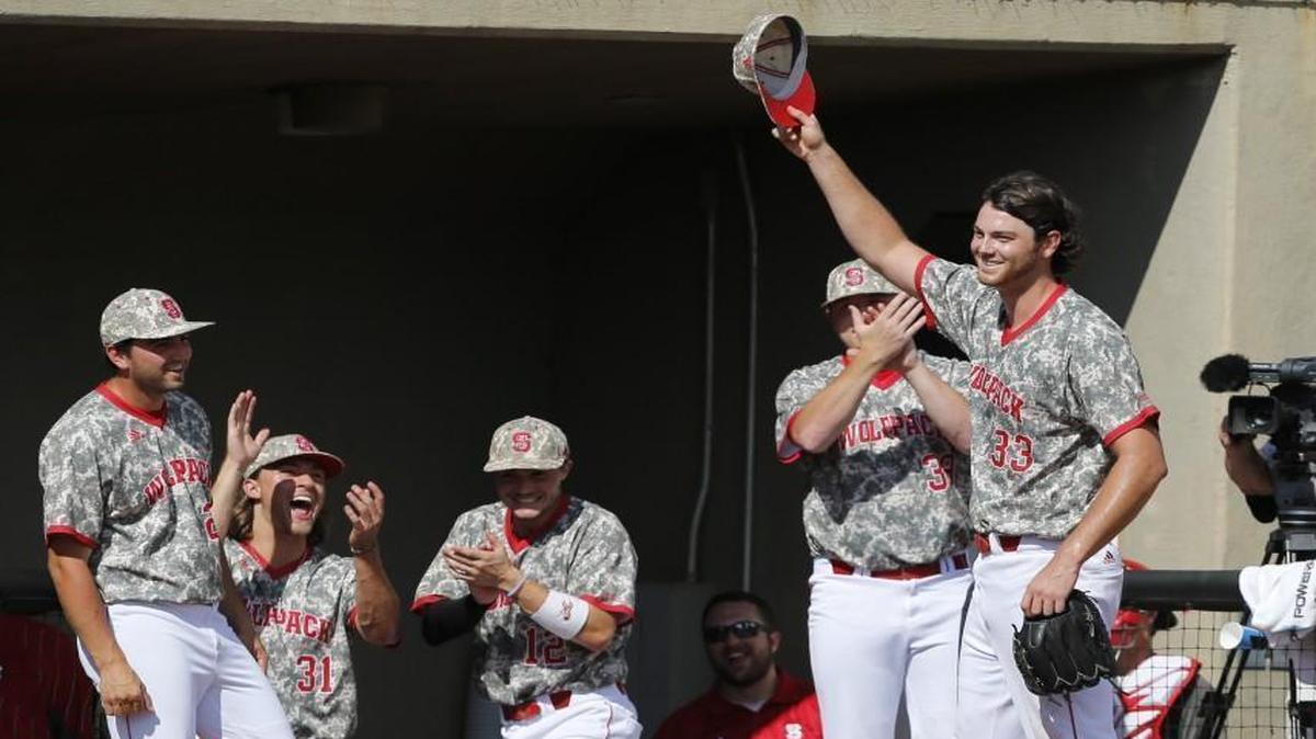 N.C. State's Johnny Piedmonte (33) takes a curtain call after pitching 8 2/3 innings during the Wolfpack's 17-1 victory over Navy in an elimination game in the Raleigh Regional of the 2016 NCAA Division I Men’s Baseball Championship at Doak Field.