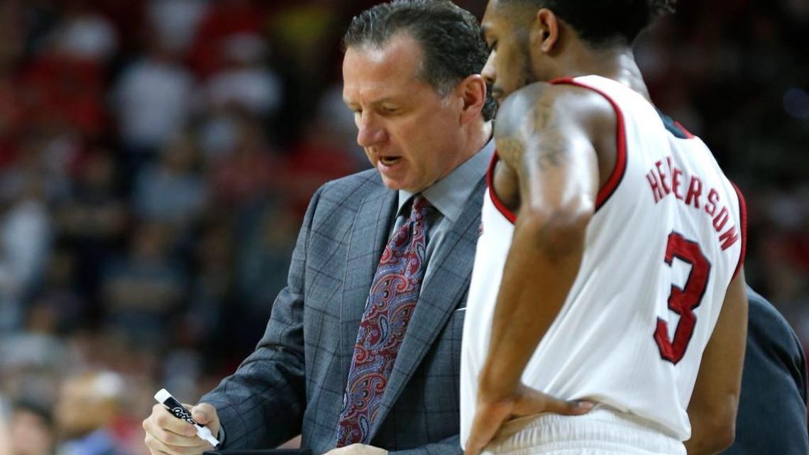 N.C. State head coach Mark Gottfried talks with Terry Henderson during Wake Forest's 93-88 victory at PNC Arena on Jan. 21, 2017.