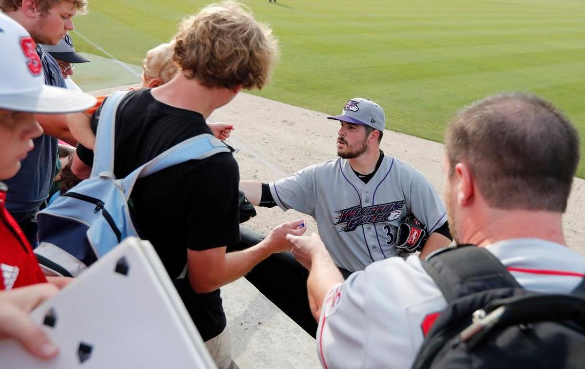 Former N.C. State pitcher Carlos Rodon signs autographs for fans after pitching for Winston-Salem Dash during their game with the Carolina Mudcats at Five County Stadium in Zebulon, N.C., Tuesday, June 6, 2017.