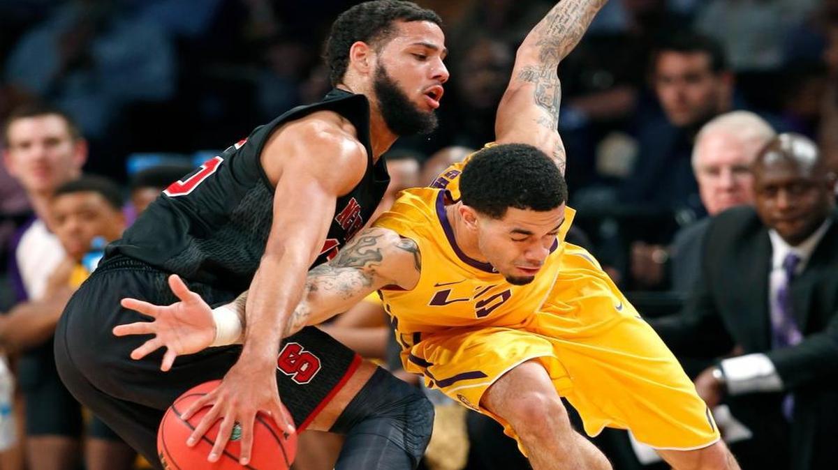 N.C. State’s Cody Martin, left, steals the ball from LSU guard Josh Gray (5) during the first half of an NCAA college basketball game for third place in the Legends Classic, Tuesday, Nov. 24, 2015, in New York.