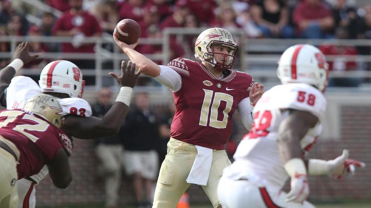 Florida State's Sean Maguire (10) attempts a pass against the N.C. State defense in the second quarter in Tallahassee, Fla.