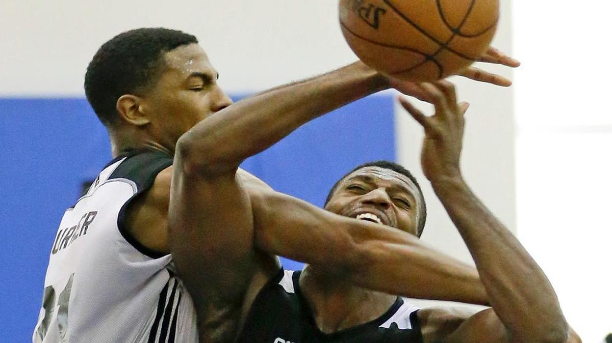 
Charlotte Hornets' Ralston Turner, left, fouls Orlando Magic White's Melvin Ejim as he tries to block a shot during the second half of an NBA summer league basketball game, Wednesday, July 8, 2015, in Orlando, Fla.

