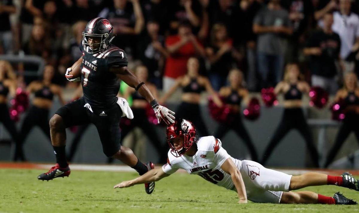 N.C. State's Nyheim Hines (7) beats Louisville place kicker Blanton Creque (45) on a 48-yard kickoff return during the second half of the Wolfpack’s victory.