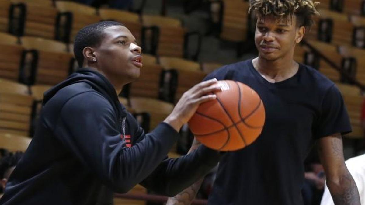 N.C. State's Dennis Smith Jr., left, shoots as Shaun Kirk watches during warmups before the Wolfpack's game against Virginia Tech at Cassell Coliseum in Blacksburg.