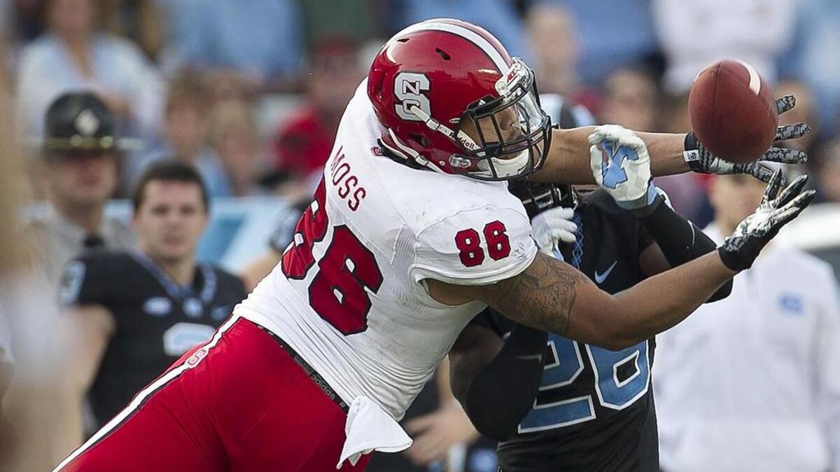 North Carolina’s Dominquie Green (26) breaks up a pass intended for N.C. State tight end Thaddeus Moss (86) in the fourth quarter.