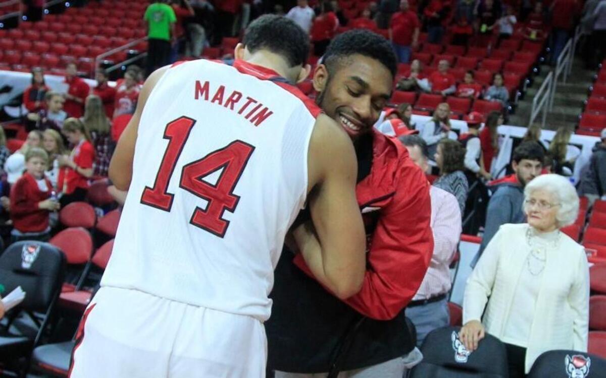 N.C. State's Caleb Martin (14) is congratulated by Terry Henderson after N.C. State's 88-70 victory over South Alabama at PNC Arena in Raleigh Sunday, Nov. 15, 2015.