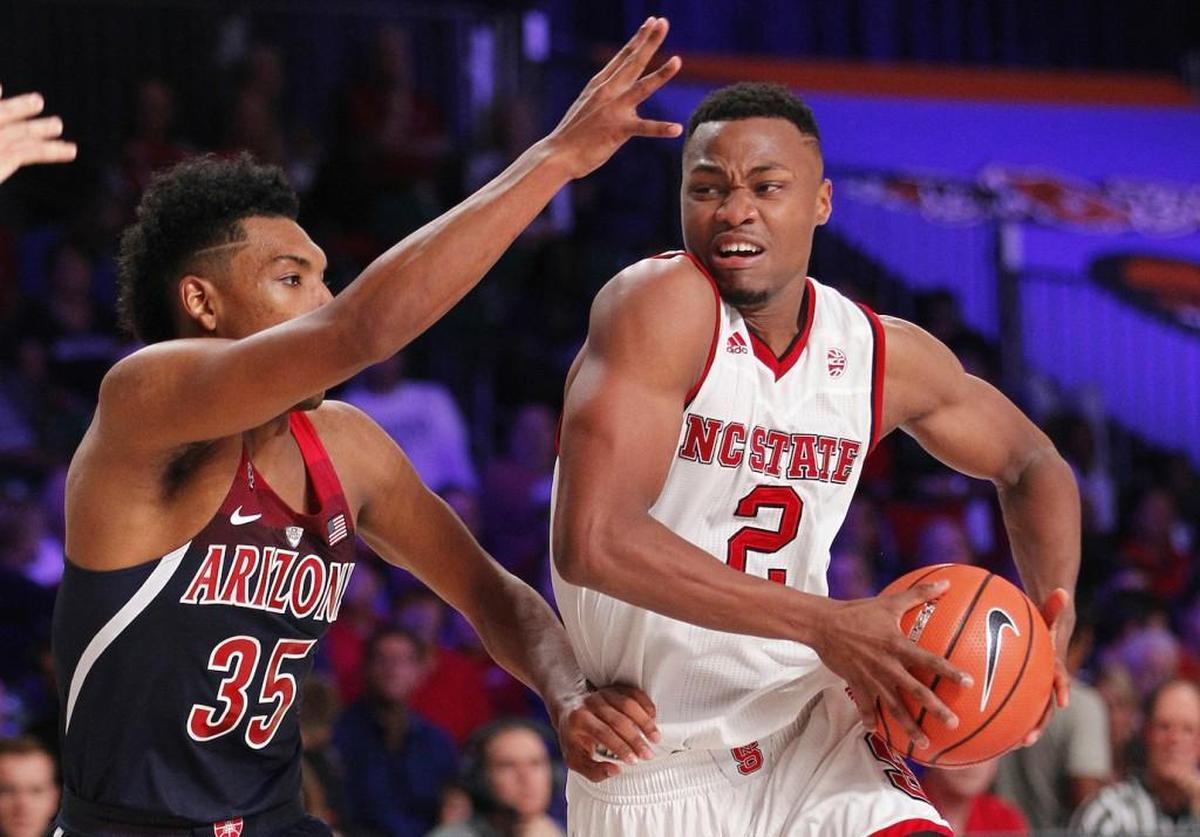North Carolina State guard Torin Dorn (2) drives to the basket while Arizona guard Allonzo Trier (35) defends.