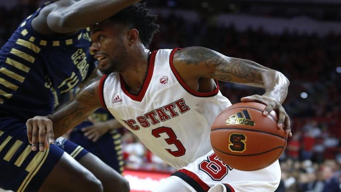 N.C. State's Terry Henderson drives around Georgia Southern's Coye Simmons during the second half of the Wolfpack’s 81-79 victory at PNC Arena in Raleigh.