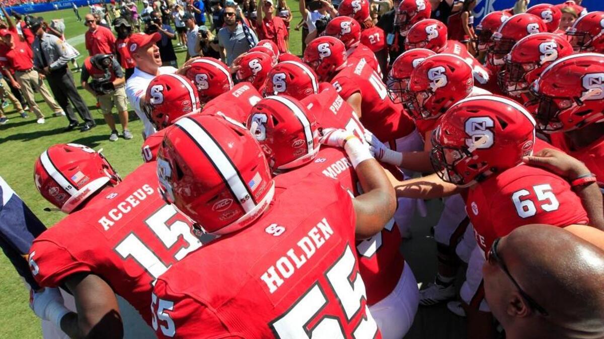 N.C. State coach Dave Doeren gets ready to lead the team out onto the field before the Wolfpack’s game against South Carolina on Sept. 2. The Wolfpack plays Marshall on Saturday.