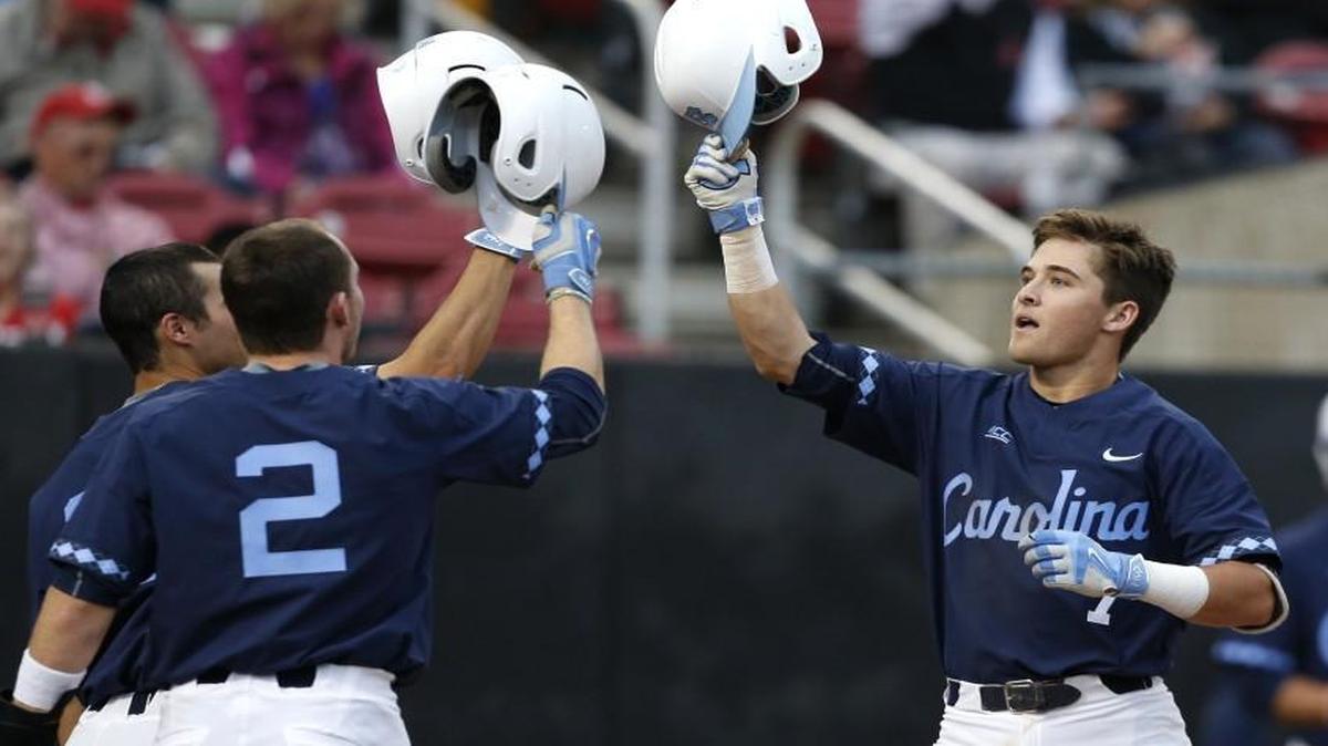 North Carolina's Logan Warmoth, right, celebrates with teammates including Adam Pate (2) after hitting a two-run home run in the fourth inning during he game against N.C. State at Doak Field in Raleigh.