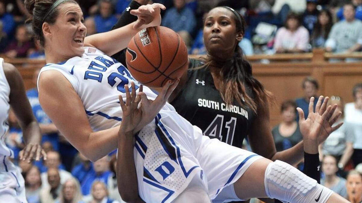 Duke guard Rebecca Greenwell (23) is upended as she goes in for a second half shot against South Carolina at Cameron Indoor Stadium Dec.7, 2014 in Durham.
