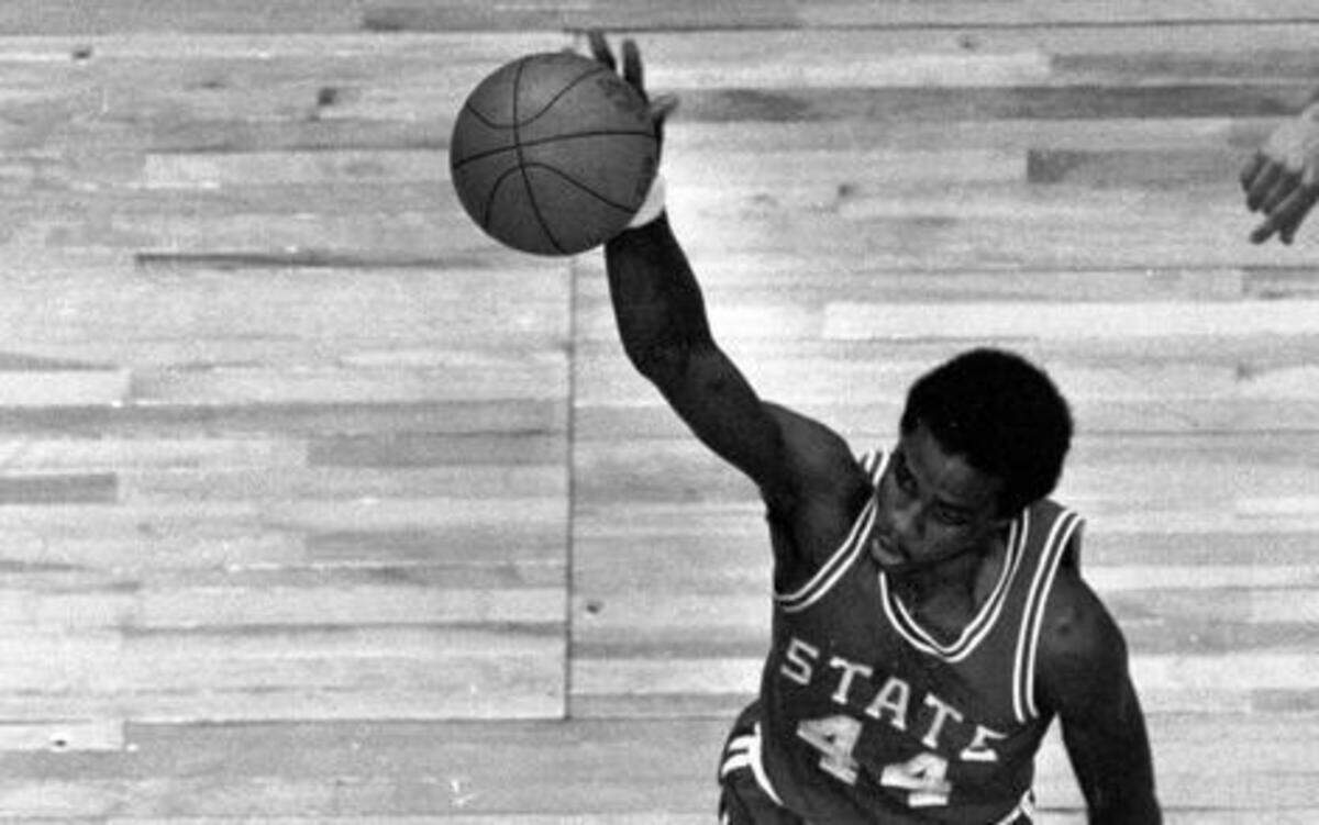 
N.C. State’s David Thompson soars to the basket against Virginia during the 1974 ACC tournament at the Greensboro Coliseum
