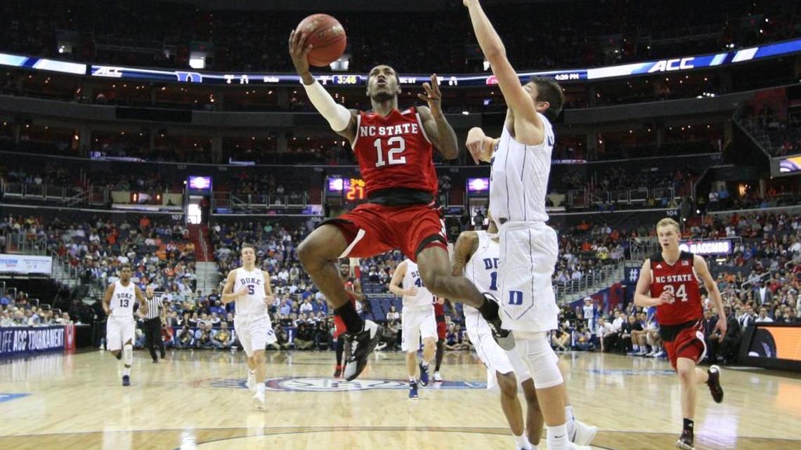 N.C. State’s Cat Barber (12) drives to the basket as Duke’s Grayson Allen (3) defends him in Duke’s 92-89 ACC tournament win on March 9. Barber, who was at N.C. State’s game against UNC on Wednesday, hopes his former team can still turn around its season.