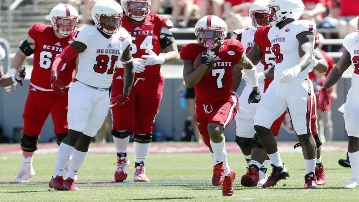 N.C. State's Nyheim Hines (7) cuts through the defense as he runs a drill during the Kay Yow N.C. State intra-squad spring football game at Carter-Finley Stadium in Raleigh,.