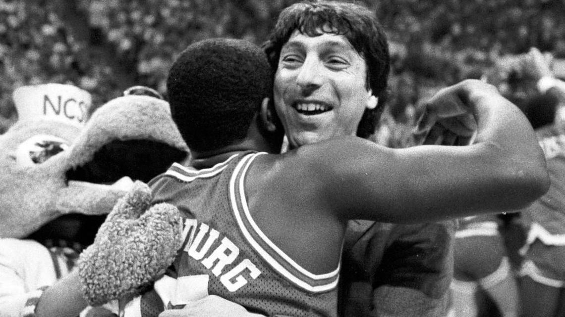 NC State head coach Jim Valvano embraces Dereck Wittenburg.