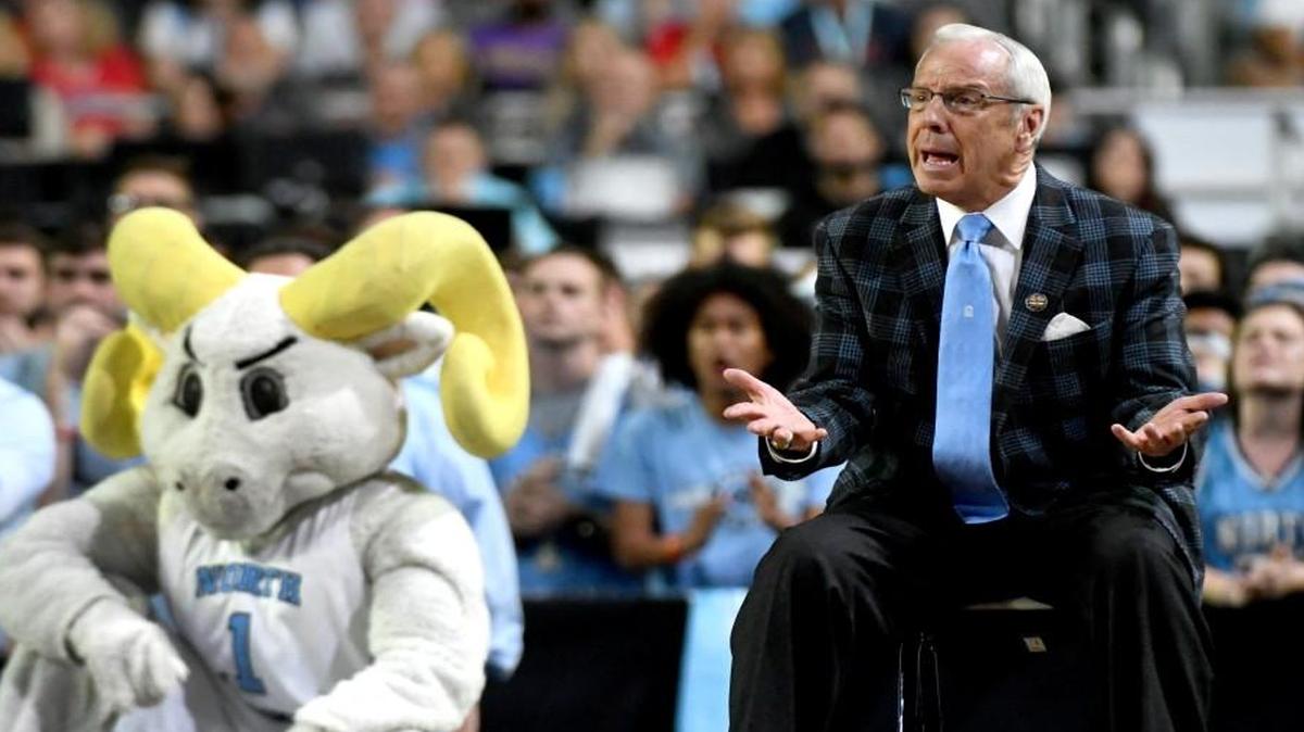 From the sideline, UNC coach Roy Williams watches the Tar Heels in the national title game against Gonzaga in April. Proposed NCAA basketball rules changes would increase the size of the coach’s box from 28 to 38 feet.