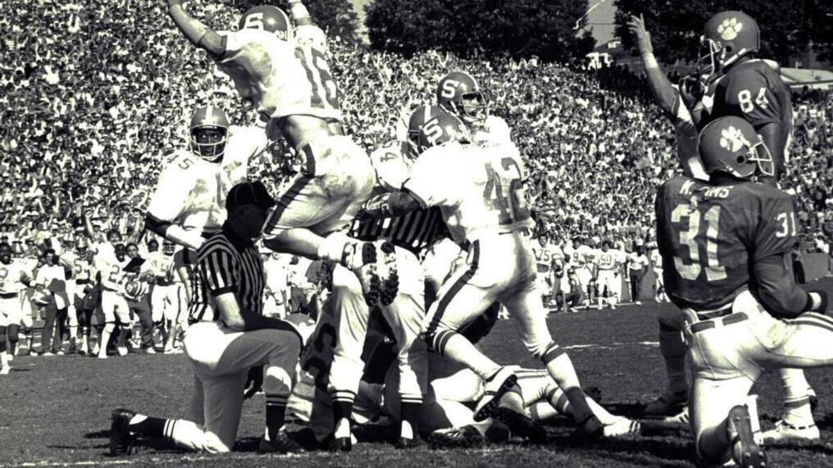N.C. State’s Mike Nall celebrates as the Wolfpack makes a goal-line stand against Clemson in 1979.