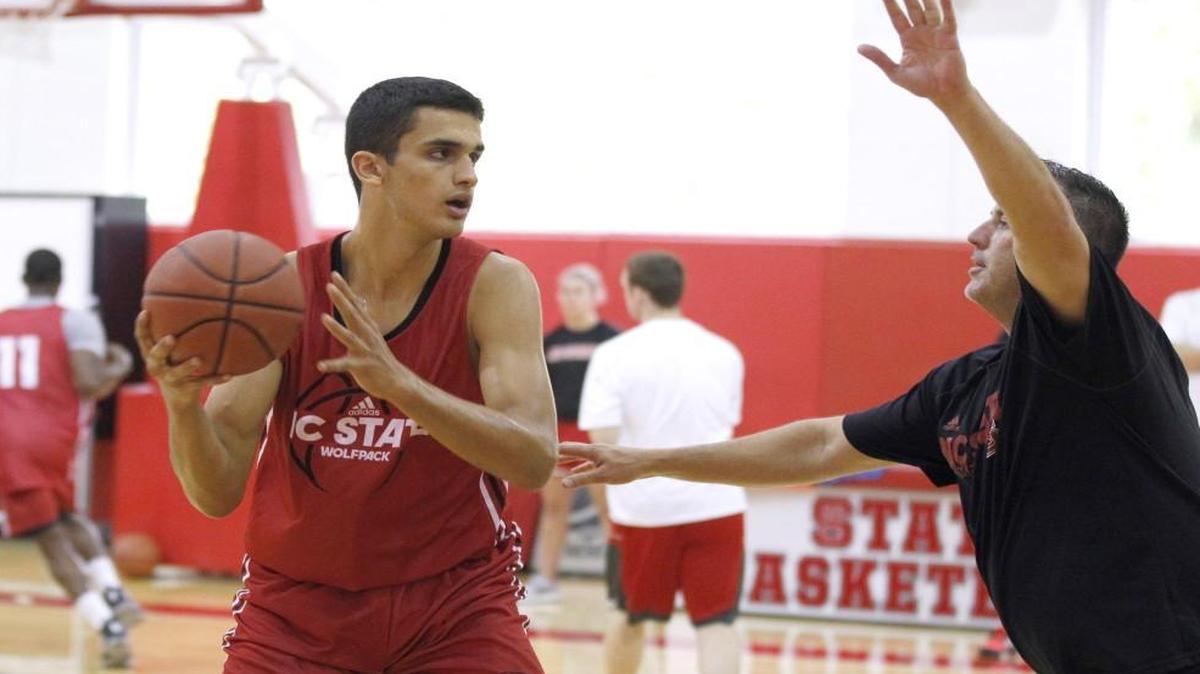 N.C. State assistant coach Heath Schroyer works with Omer Yurtseven (14) during N.C. State basketball's first practice of the season at the Curtis & Jacqueline Dail Basketball Complex in Raleigh Friday, Sept. 30, 2016.