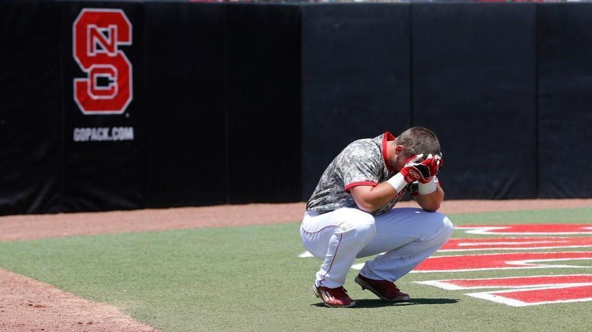 N.C. State's Chance Shepard (24) reacts on the field after Coastal Carolina's 7-5 victory over N.C. State in the Raleigh Regional of the 2016 NCAA Division I Men’s Baseball Championship at Doak Field in Raleigh on Tuesday, June 7, 2016.