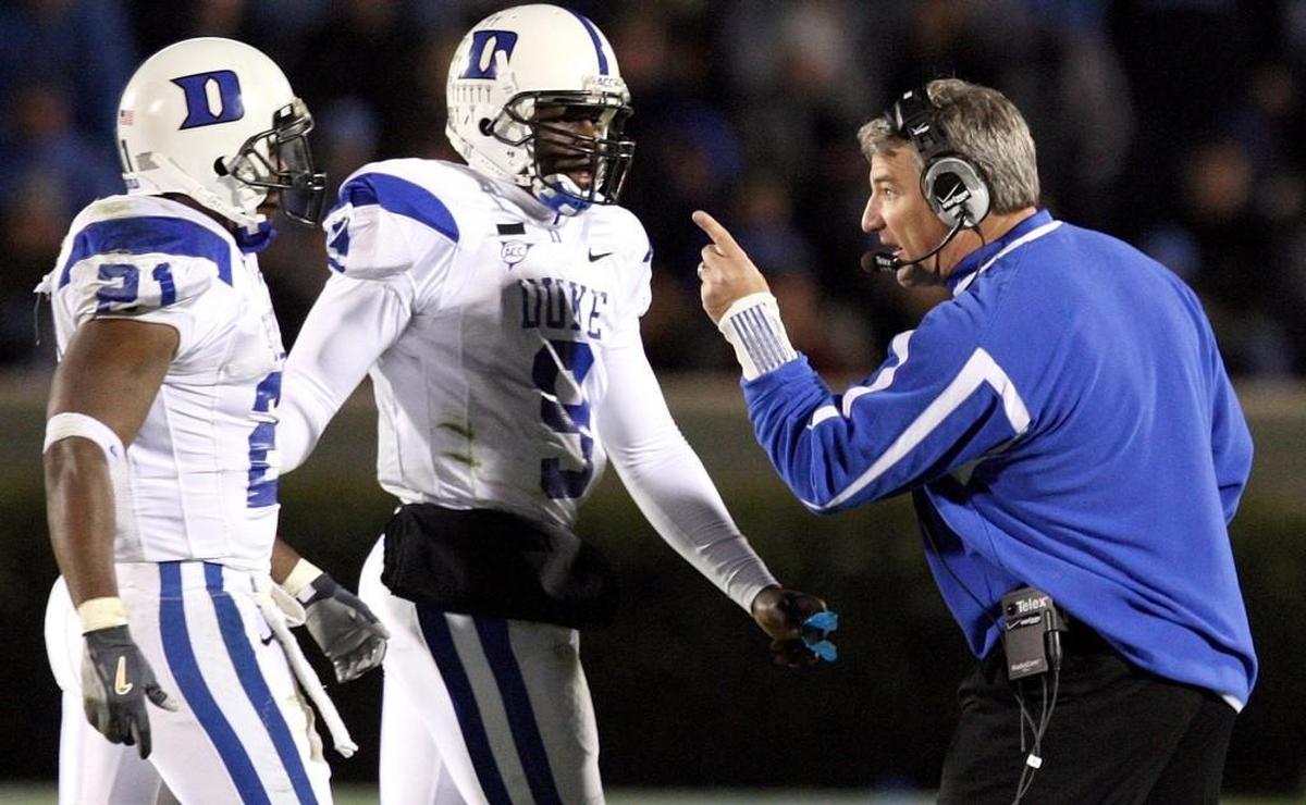 Duke head coach Ted Roof instructs Re'quan Boyette's (21) after he committed a personal foul during the Blue Devils' game against UNC in Nov. 2007.