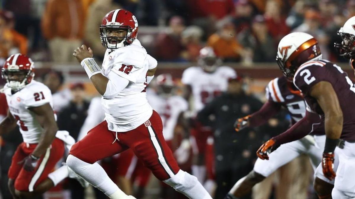 
N.C. State quarterback Jacoby Brissett runs during the first half of the Wolfpack's game against Virginia Tech at Lane Stadium in Blacksburg.
