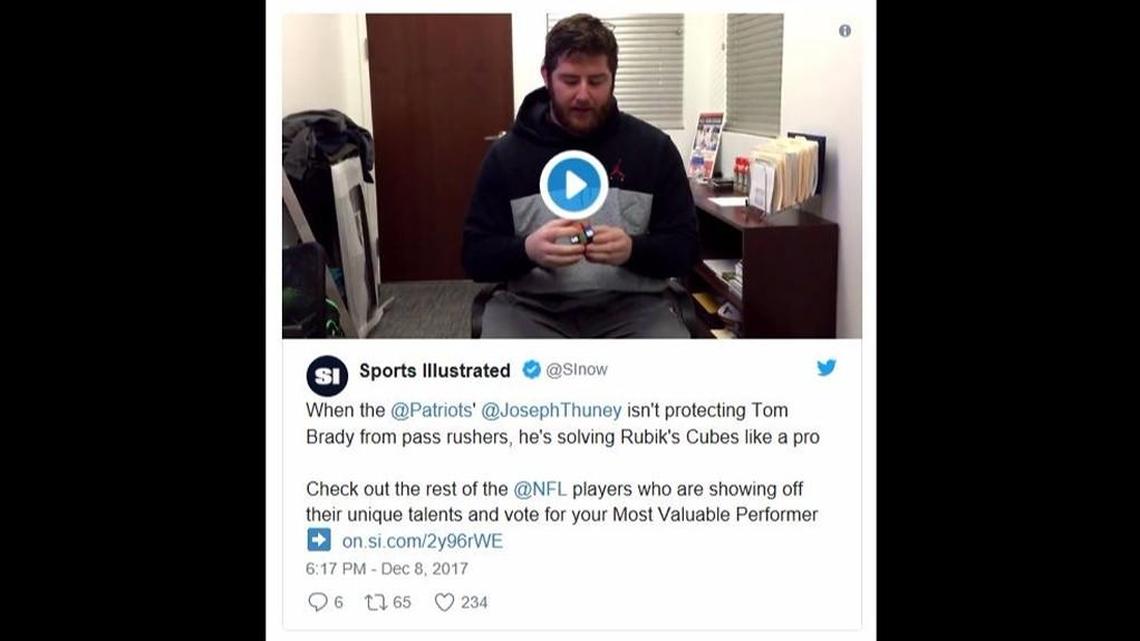 A screen shot of a Sports Illustrated tweet with a video of former NC State player Joe Thuney solving a Rubik’s Cube.