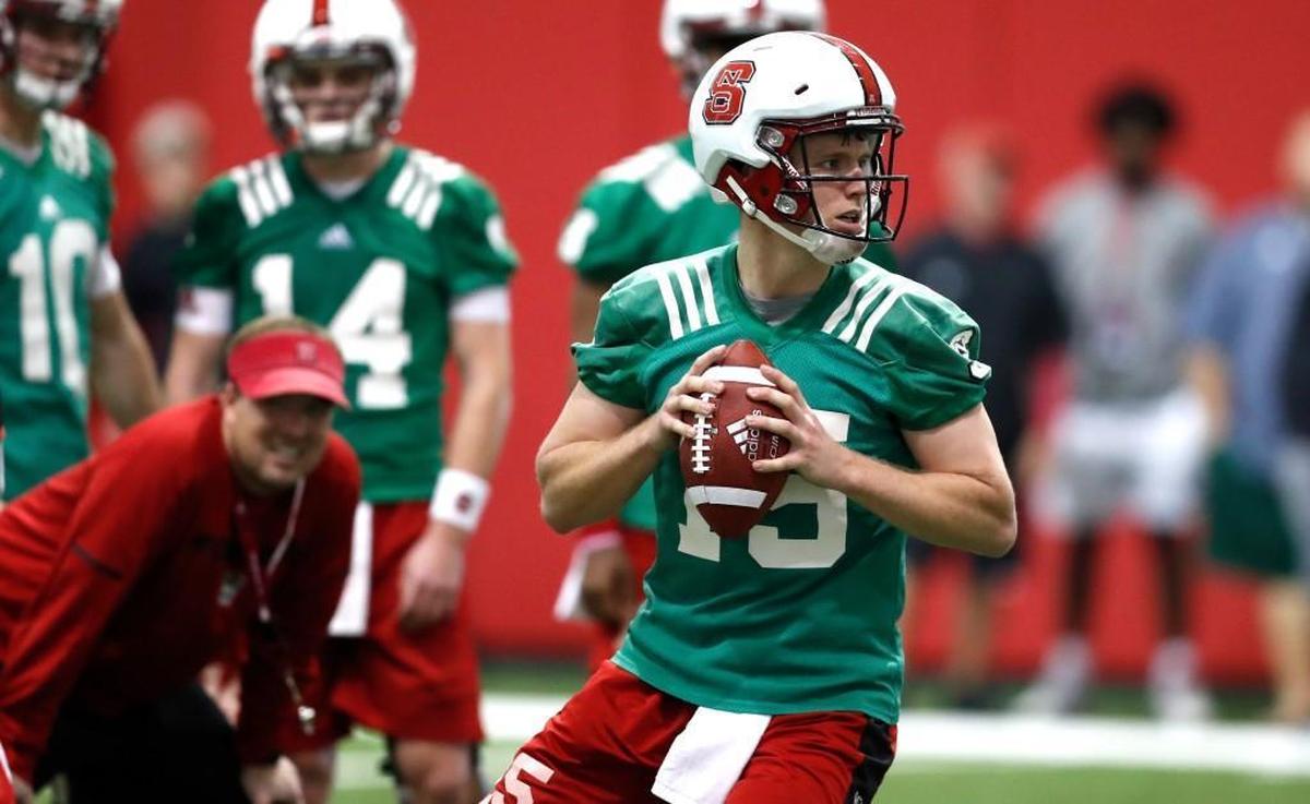 N.C. State quarterback Ryan Finley (15) prepares to throw during the Wolfpack’s first spring practice at the Close-King Indoor Practice Facility in Raleigh Sunday, Feb. 25, 2018.