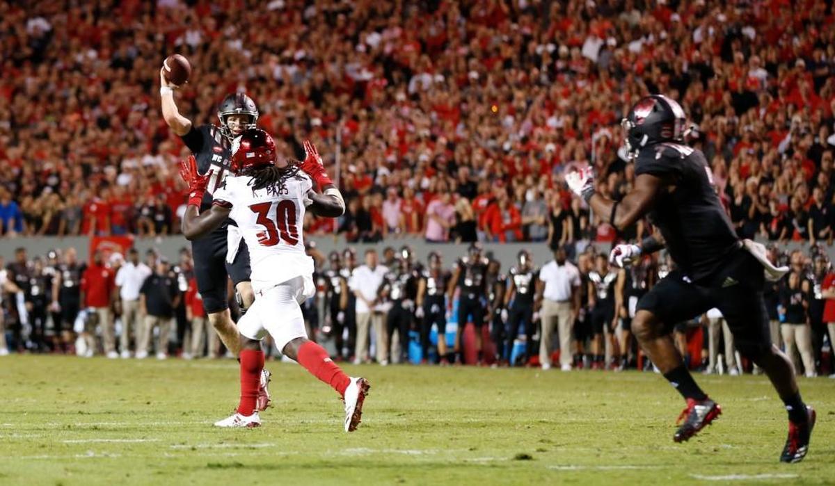 N.C. State quarterback Ryan Finley (15) passes to Nyheim Hines (7) for a 2-point conversion during the Wolfpack’s 39-25 victory over Louisville at Carter-Finley Stadium Thursday, Oct. 5, 2017.