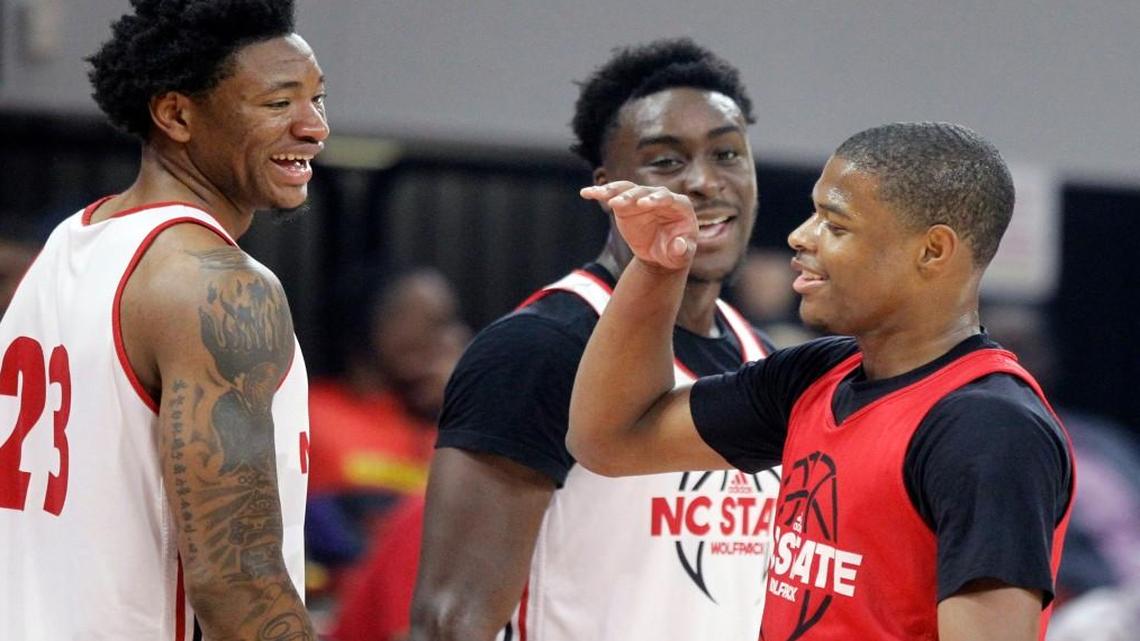 N.C. State's Dennis Smith, Jr. laughs with Ted Kapita, left, and Abdul-Malik Abu during Primetime with the Pack at N.C. State's Reynolds Coliseum in Raleigh, Friday, Oct. 21, 2016.