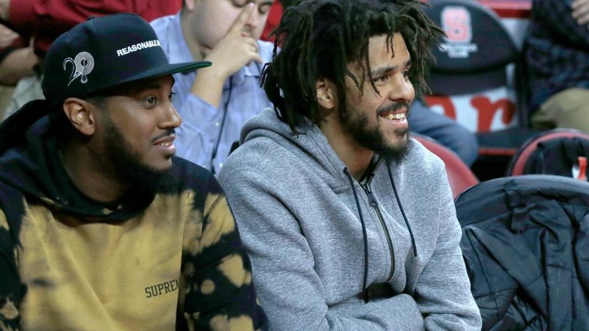 J. Cole, right, watches during the second half of N.C. State's 104-78 victory over Virginia Tech at PNC Arena in Raleigh, N.C., Wednesday, January 4, 2017.