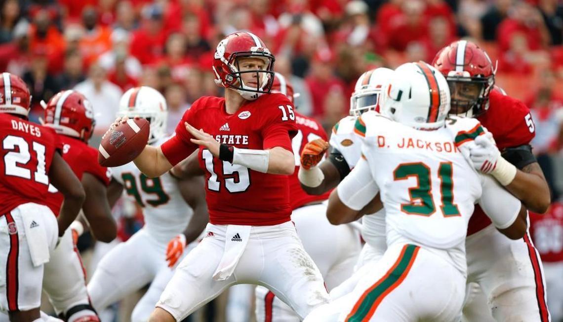 Quarterback Ryan Finley, middle, prepares to throw the football against Miami in 2016.