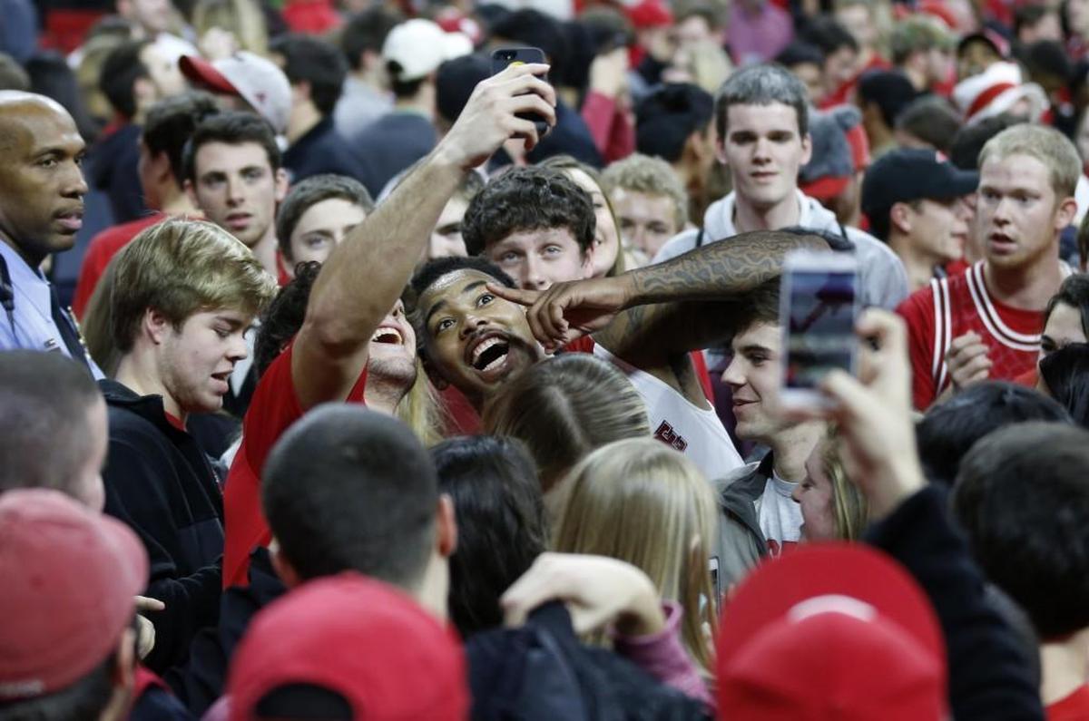 N.C. State’s Trevor Lacey celebrates with fans after the Wolfpack’s 87-75 victory over Duke at PNC Arena on Jan. 11, 2015.