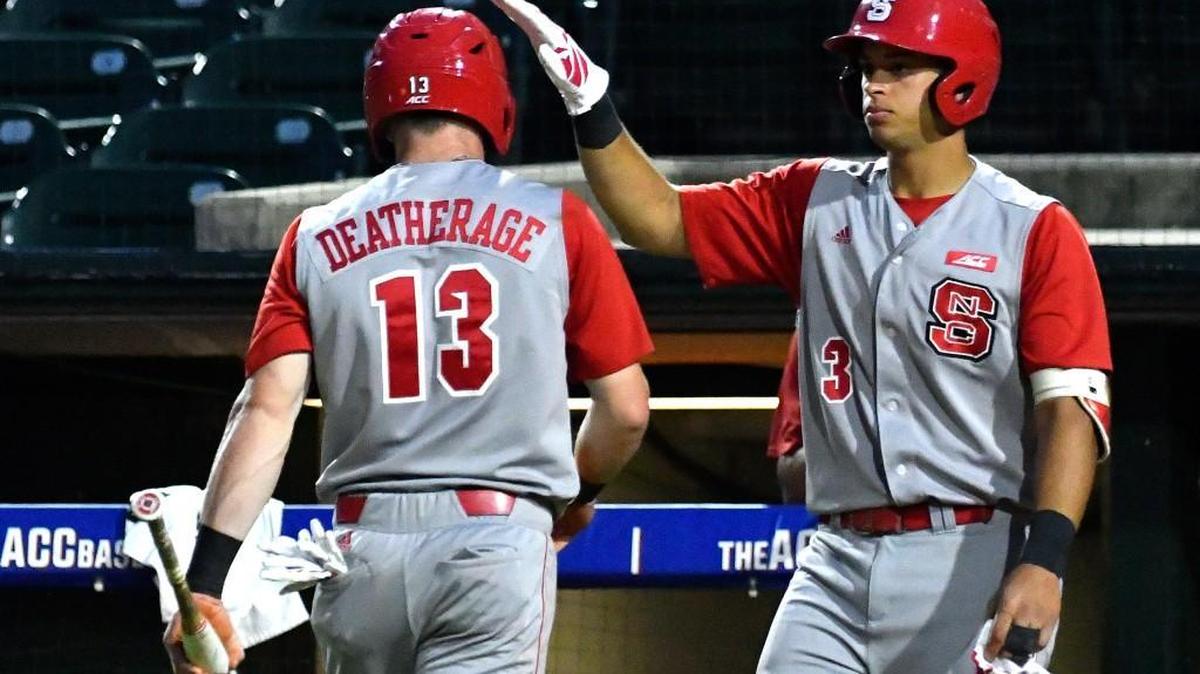 N.C. State’s Brock Deatherage, left, is congratulated by Joe Dunand during the ACC baseball tournament. The Wolfpack will play Indiana Friday in the Lexington regional of the NCAA tournament.