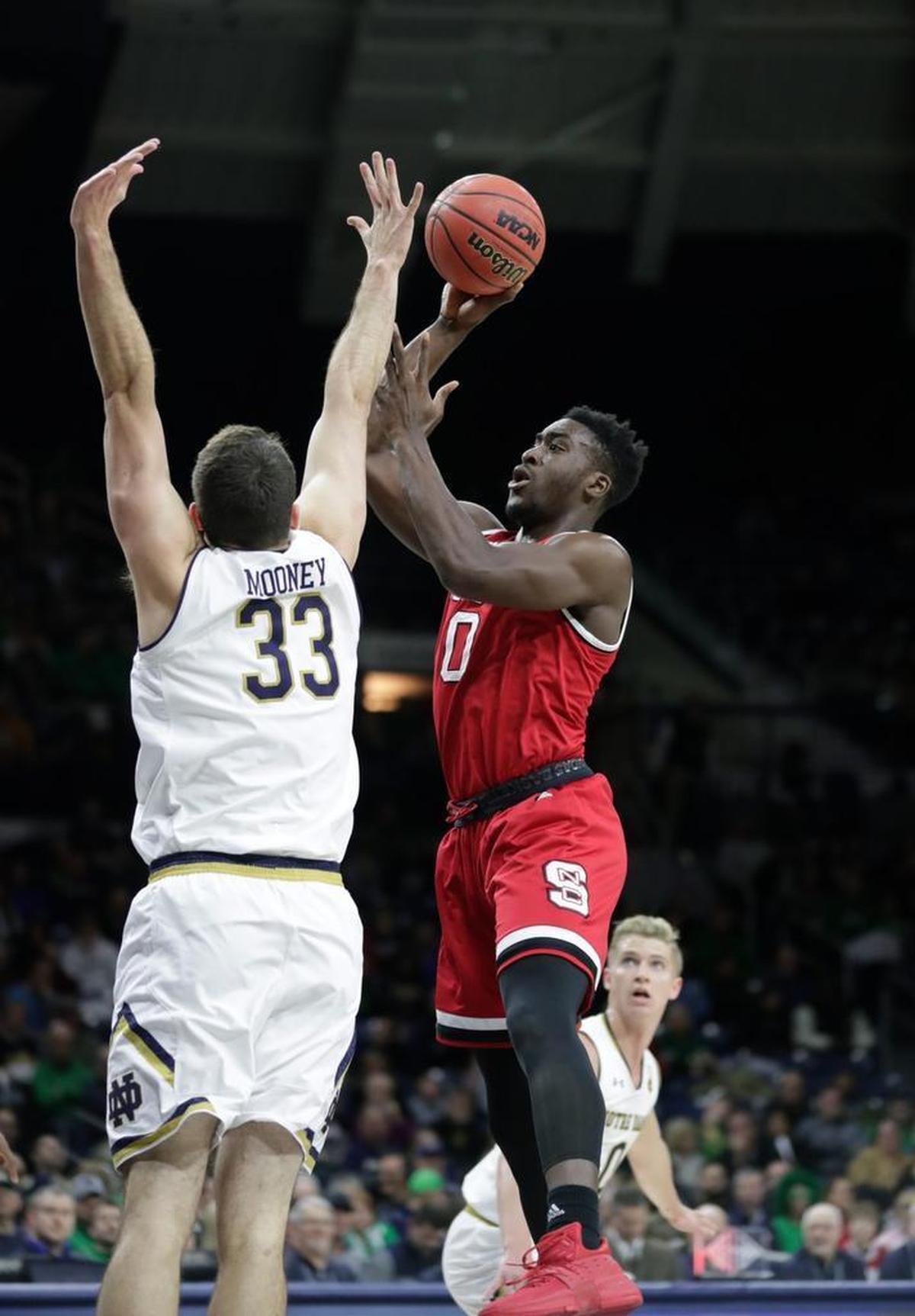 N.C. State forward Abdul-Malik Abu, right, shoots over Notre Dame forward John Mooney on Wednesday.