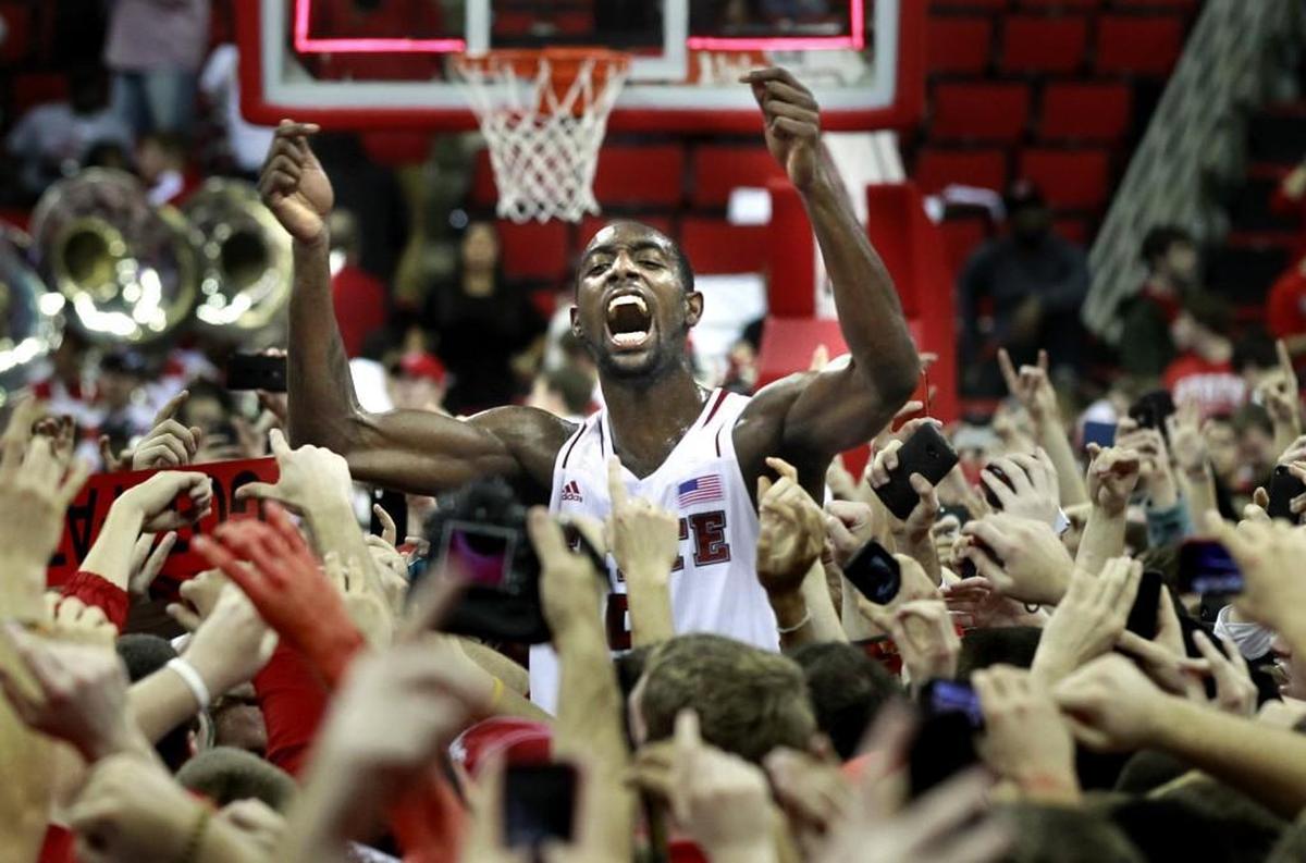 N.C. State’s C.J. Leslie, middle, celebrates with the fans after the Wolfpack’s 84-76 win over Duke on Jan. 12, 2013.