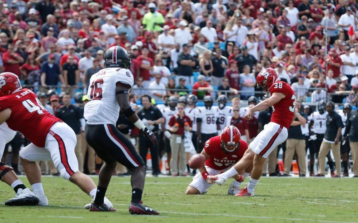 N.C. State's Carson Wise (38) makes the extra point as A.J. Cole III (90) holds the ball during game against South Carolina during the Belk College Kickoff at Bank of America Stadium in Charlotte on Sept. 2, 2017. Extra points gave Wise trouble in the Marshall game. He missed one and another extra point bounced off the upright before going through.